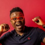 man in black polo shirt wearing black framed eyeglasses